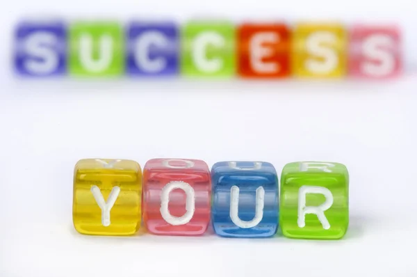 Text Your success on colorful wooden cubes — Stock Photo, Image