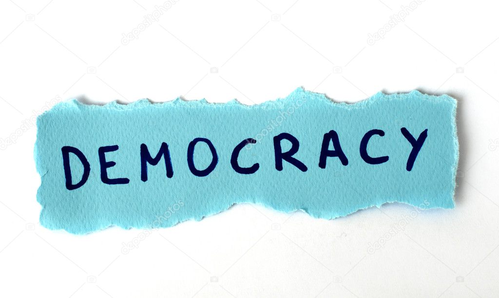 The word Democracy on blue paper