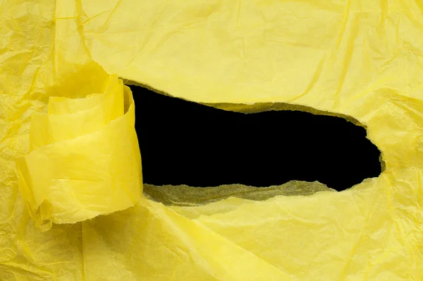 Żółty papier rozdarty z czarna przestrzeń — Zdjęcie stockowe