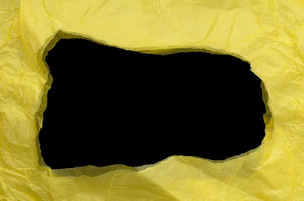Papel rasgado amarelo com espaço preto — Fotografia de Stock