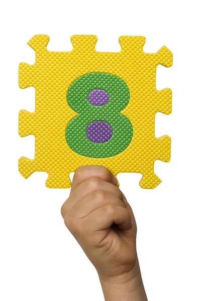 Children hand holding the number Eight. White isolated number — Stock Photo, Image