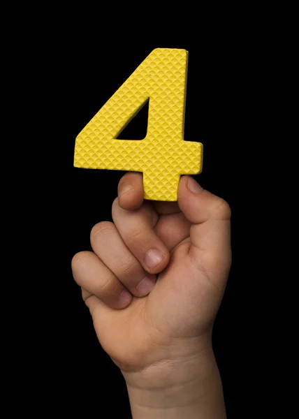 Children hand holding the number Four. — Stock Photo, Image