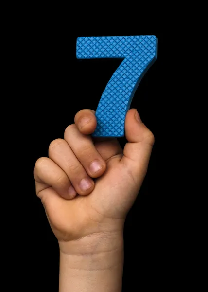 Children hand holding the number Seven — Stock Photo, Image