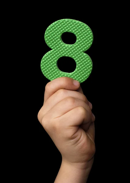 Children hand holding the number Eight — Stock Photo, Image