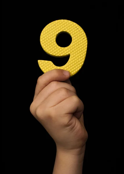 Children hand holding the number Nine — Stock Photo, Image
