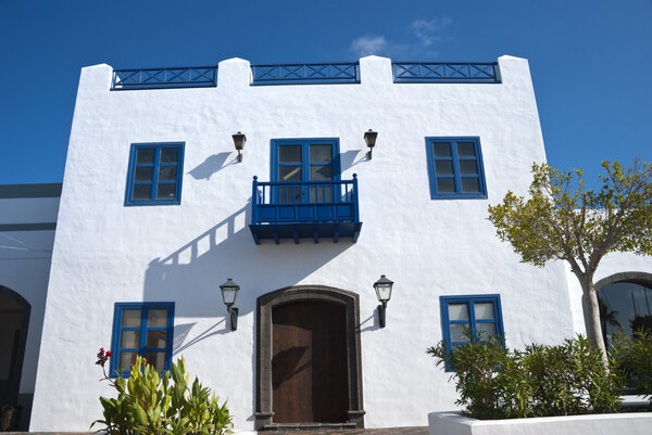 A Traditional Blue and White Canary Island House with a Balcony