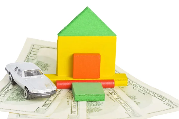 Model of house and car standing on money — Stock Photo, Image