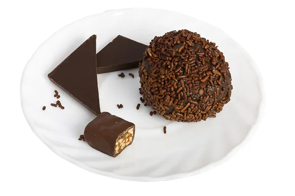 Chocolate ball and slices of chocolate bar — Stock Photo, Image