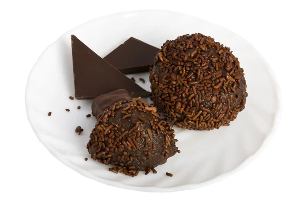 Dos bolas de chocolate en un platillo — Foto de Stock