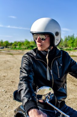 Motorcycle cop in a helmet and goggles clipart