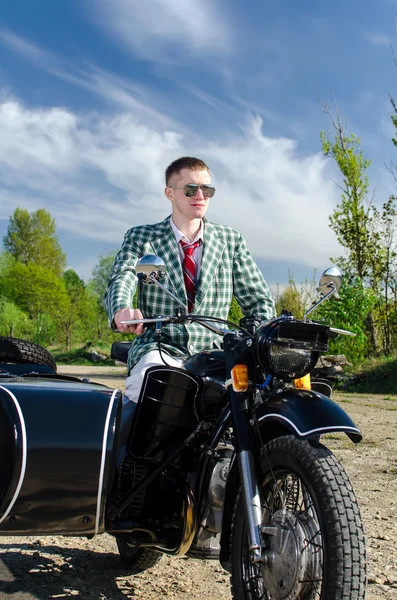 Classy guy on a motorcycle with a sidecar — Stock Photo, Image