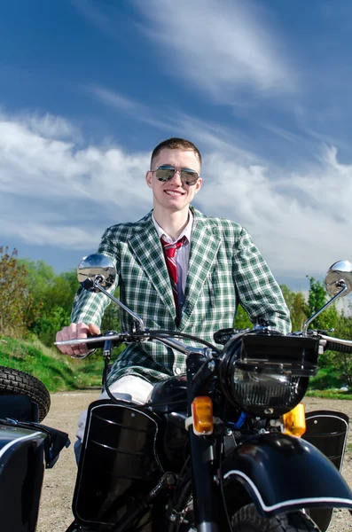 Classy guy on a motorcycle with a sidecar — Stock Photo, Image