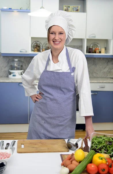 Smiling chief cook in the kitchen — Stock Photo, Image