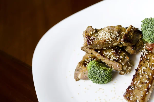 stock image Baked pork ribs on a white plate