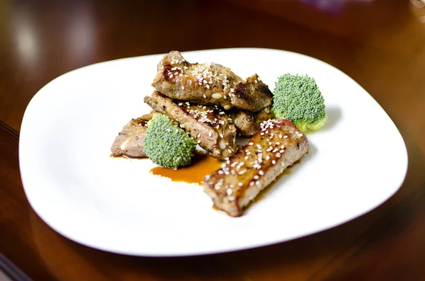 Stock image Baked pork ribs on a white plate