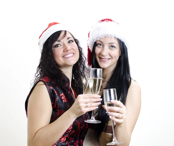 Noel: kırmızı şapkalı iki kız iyi eğlenceler — Stok fotoğraf