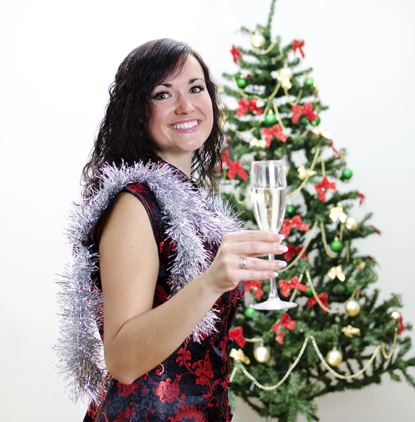 Christmas: girl congratulates with glass of wine — Stock Photo, Image
