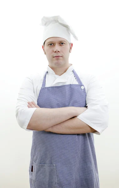 Portrét pohledného šéfkuchaře se zkříženýma rukama — Stock fotografie