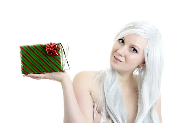 Attractive blond girl holding gift in hand isolated on white — Stock Photo, Image