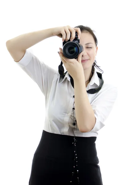 Giovane ragazza bruna con fotocamera isolata su bianco — Foto Stock