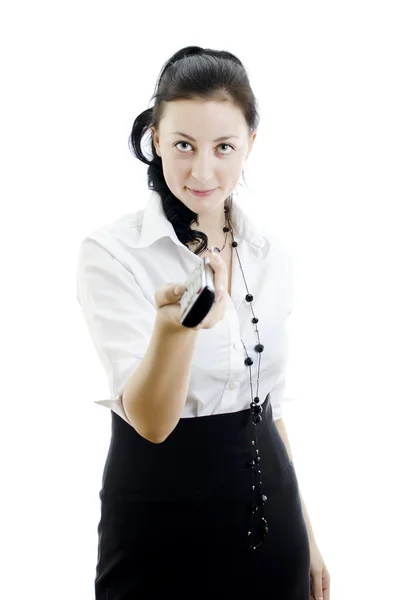 Mujer sosteniendo control remoto aislado sobre fondo blanco — Foto de Stock