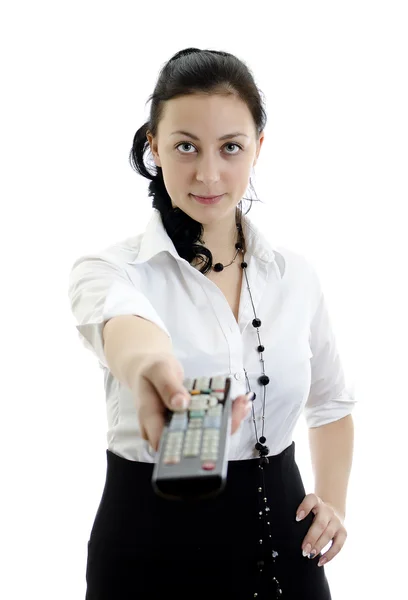 Mulher segurando controle remoto isolado no fundo branco — Fotografia de Stock