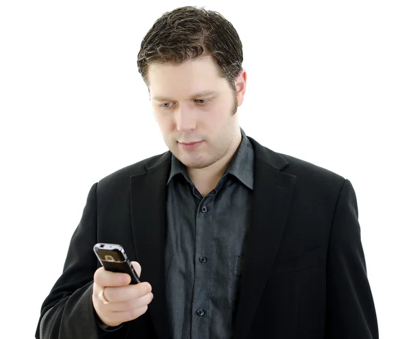 Retrato de um jovem homem de negócios bonito usando telefone celular. Isolados em w — Fotografia de Stock