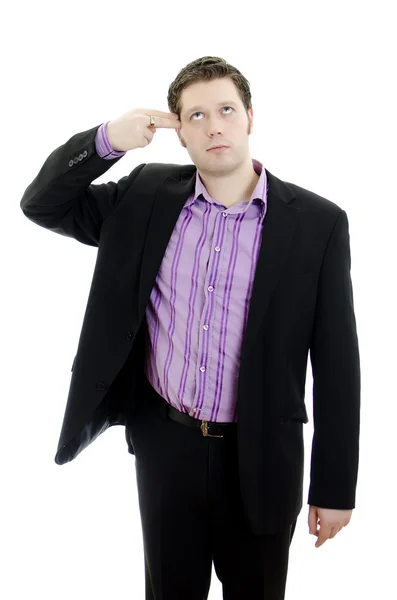 Portrait of a young business manputs two fingers to his temple. Isolated ov — Stock Photo, Image