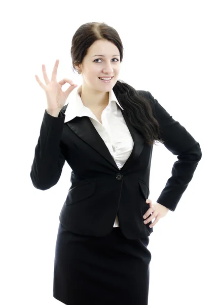 Retrato de una mujer de negocios haciendo un gesto de buena señal. Aislado sobre blanco . — Foto de Stock