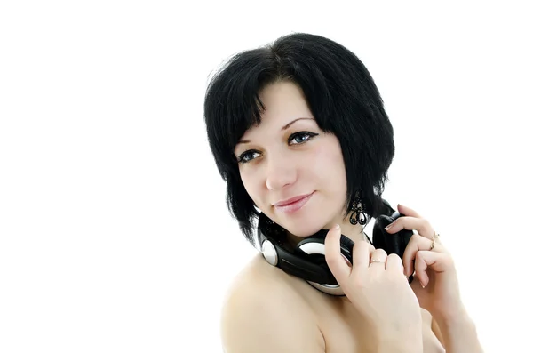 Close-up portrait of brunette woman with headphones, isolated over white ba — Stock Photo, Image