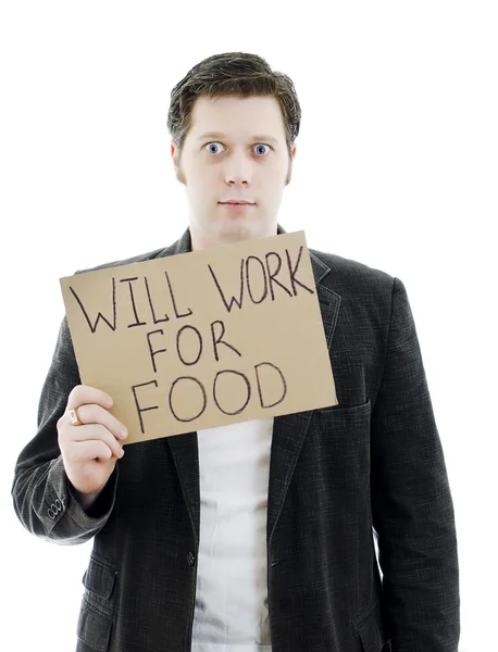 L'uomo d'affari disoccupato con un segno LAVORA 'PER L'ALIMENTAZIONE. Isolato su bianco . — Foto Stock