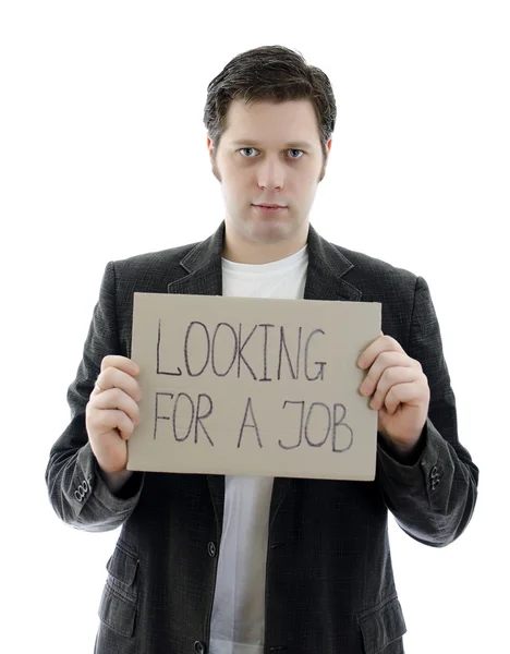 Unemployed businessman with a sign LOOKING FOR A JOB. Isolated on white. — Stock Photo, Image