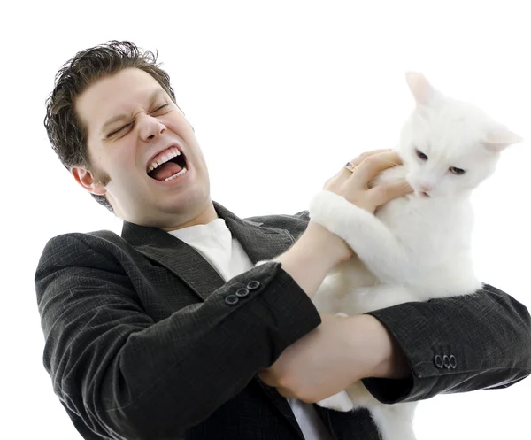 Man fighting with white cat. Isolated on white. — Stock Photo, Image
