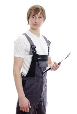 Young warehouse worker with notepad. Isolated on white background. clipart