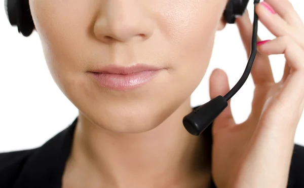 女性客户支持与耳机的运算符。脸上的一部分。在白色隔离. — 图库照片
