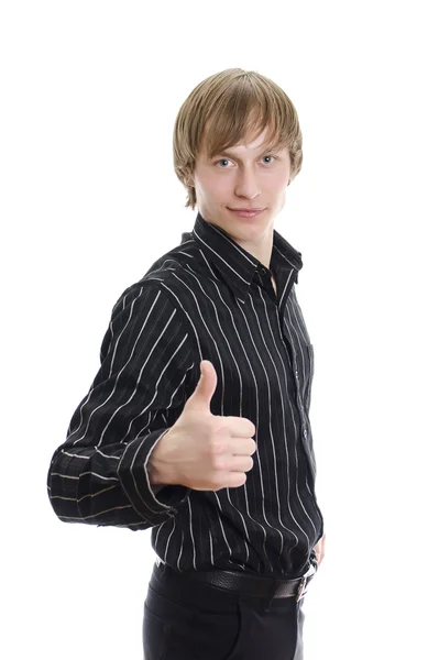 Випадковий молодий чоловік показує великий палець вгору і посміхається. Ізольовані на білому . — стокове фото