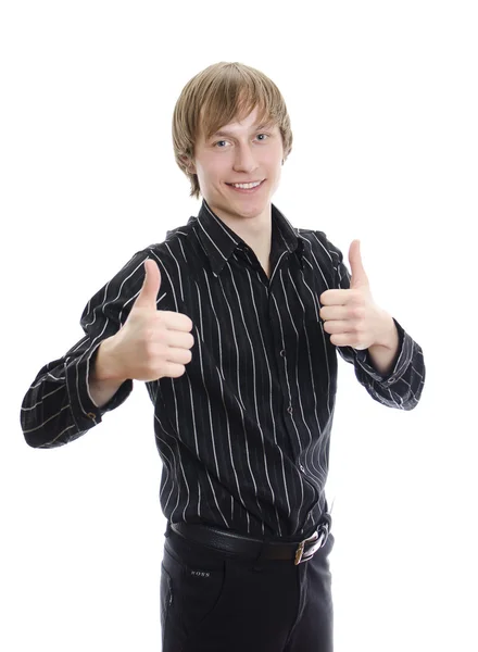 Випадковий молодий чоловік показує великий палець вгору і посміхається. Ізольовані на білому . — стокове фото