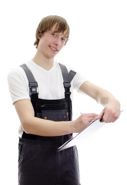 Jonge magazijnmedewerker maakt notities. geïsoleerd op witte achtergrond. — Stockfoto
