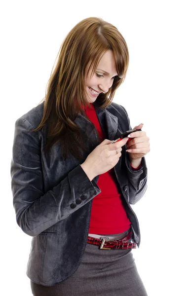 Mulher de negócios a escrever um SMS. Isolado em branco . — Fotografia de Stock
