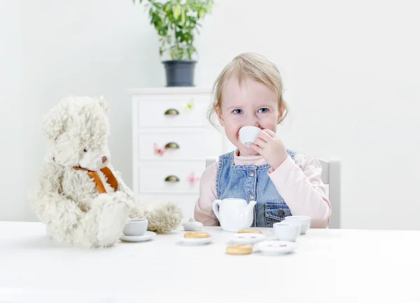 Child drink tea with bagels. — Stock Photo, Image