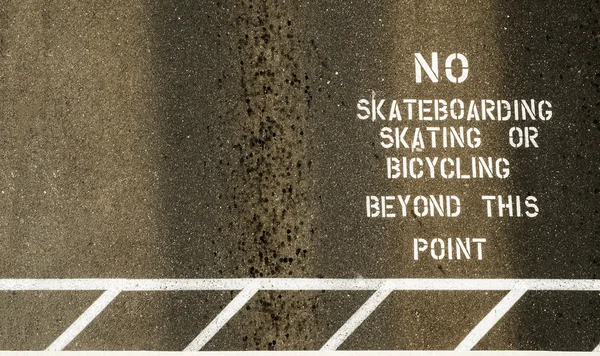 stock image No skateboarding sign painted on footpath