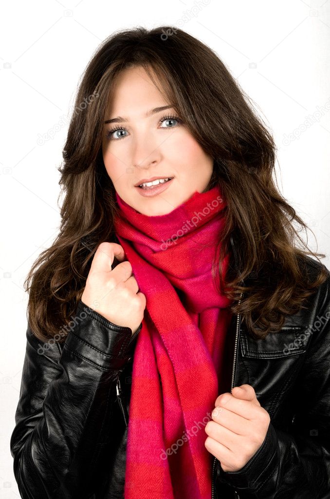 Portrait of young woman wearing black jacked and red scarf