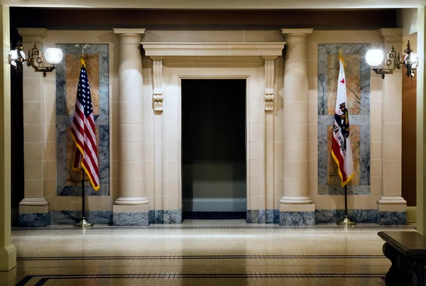 stock image Two flags in hallway