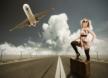 Beautiful blond woman with suitcase clipart