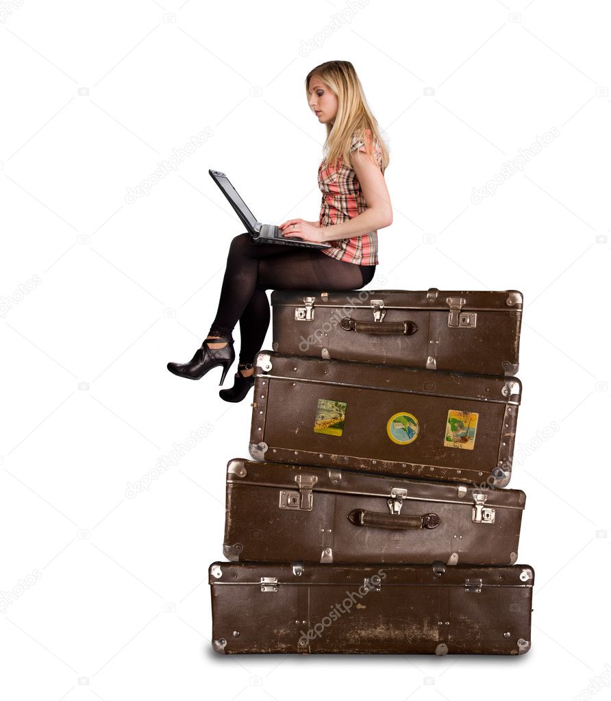Beautiful blond woman on suitcases
