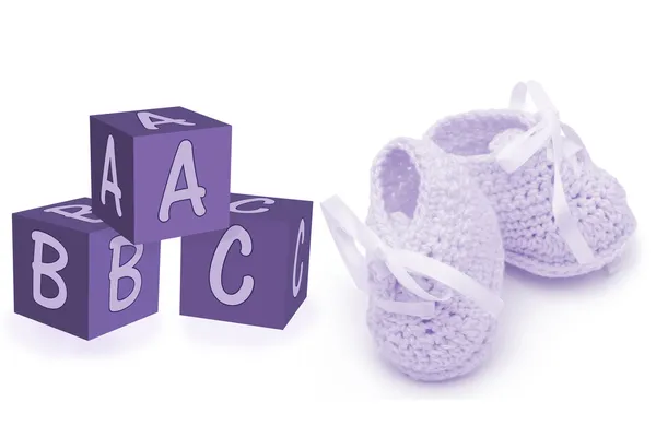 Hand-made baby booties and blocks — Stock Photo, Image