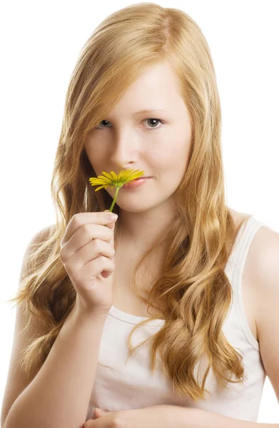 A pretty girl with a yellow flower, isolated — Stock Photo, Image