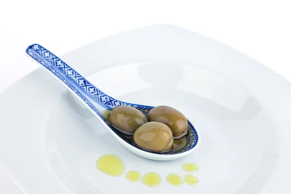 stock image Olives on spoon.