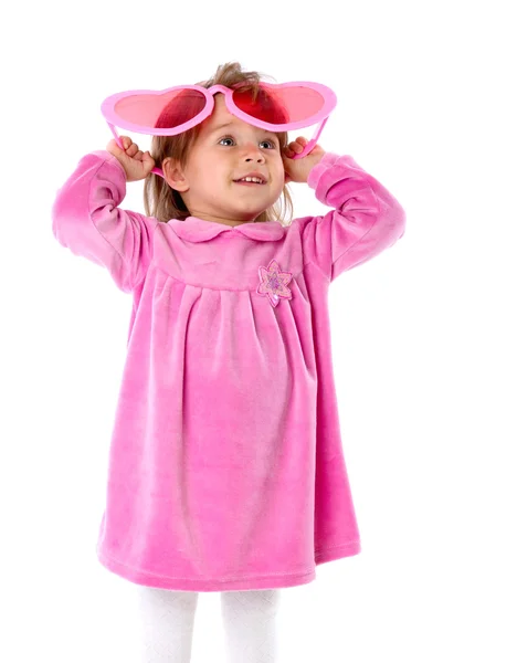 Una bambina con grandi occhiali rosa — Foto Stock