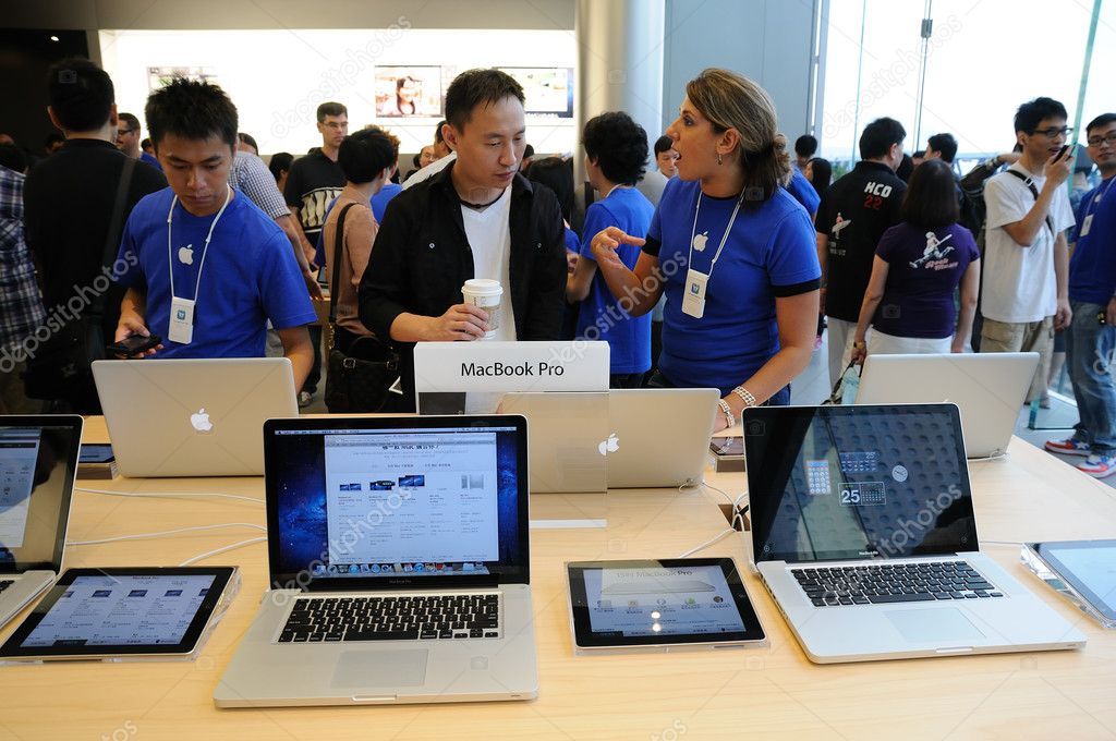 A Salesperson and Customers at an Apple Store Looking at the Latest Apple  IPhone 12 Models for Sale Editorial Stock Photo - Image of consumerism,  design: 203627358